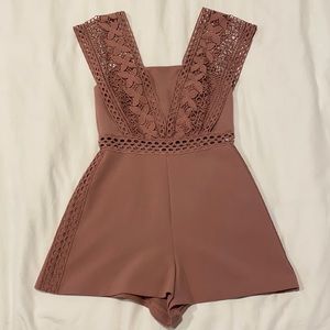 Topshop romper with cute flower details. Size 4.